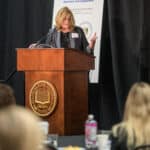 Rita Landgraf speaking at the podium during the 2024 Delaware Healthcare Workforce Summit.