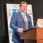 Scott Malfitano speaking at the podium during the 2024 Delaware Healthcare Workforce Summit.