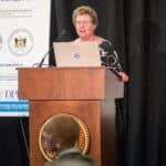 Rachel Block speaking at the podium during the 2024 Delaware Healthcare Workforce Summit.